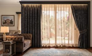 Custom floor-to-ceiling sheer and blackout curtains installed in a luxury villa in Koramangala by Sanjar Furnishings.