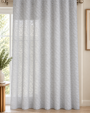 Textured semi-sheer white curtains with tab-top heading in a modern living room