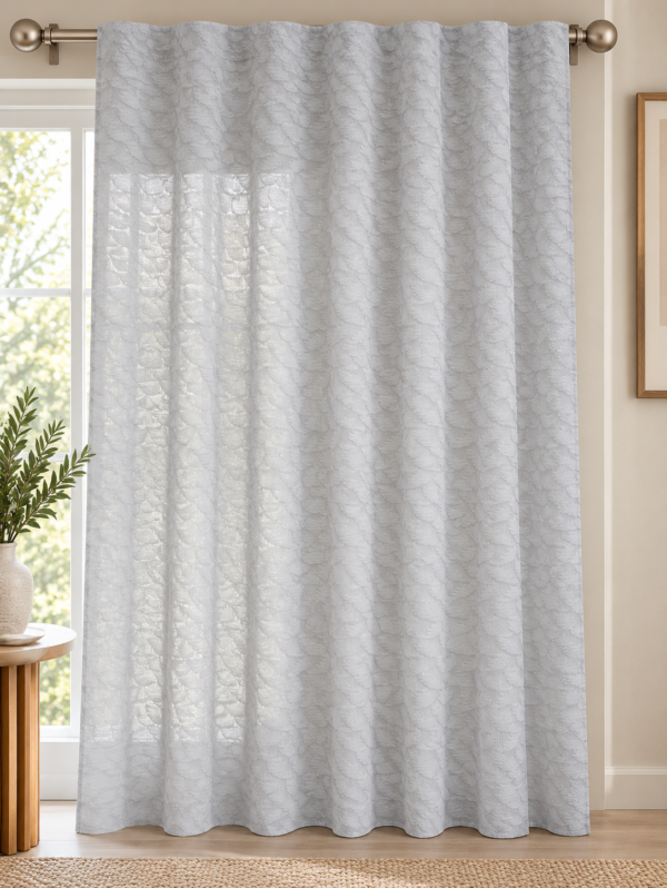 Textured semi-sheer white curtains with tab-top heading in a modern living room